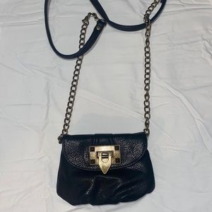 Black and brass color wallet purse